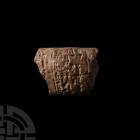 Mesopotamian Cuneiform Tablet 3rd-2nd millennium B.C. The majority of a sub-rectangular ceramic tablet with a lentoid-section body, bearing multiple l...