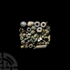 Mesopotamian Bead Collection 3rd-2nd millennium B.C. A mixed group of mainly stone and glass beads of various types and sizes. 56.9 grams total, 4-27 ...