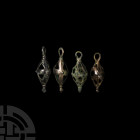 Amlash Cage Pendant Group 2nd-1st millennium B.C. A group of openwork cage pendants with integral suspension loops, each with a different geometric de...