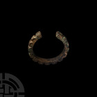 Segmented Bracelet 1st millennium A.D. A penannular bracelet with a D-section hoop, divided into angular sections and decorated on each outer face wit...