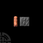 Mesopotamian Cylinder Seal with Bearded God 2nd millennium B.C. A cylinder seal with a bearded head, possibly Lamassu, facing three animal heads and a...