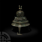 Calligraphic Incense Burner Late 19th-20th century A.D. A tiered incense burner composed of a domed lid decorated with an openwork foliate design and ...