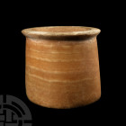 Alabaster Jar 1st millennium B.C. A carved veined alabaster jar with cylindrical body, D-section wall, everted neck and broad, flat rim. 1.2 kg, 10 cm...
