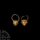 Gold Earring Pair 1st millennium B.C. A matched pair of gold earrings, each composed of a slender, round-section penannular hoop and hollow conical bo...