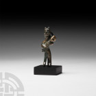 Amlash Mother and Child Figure 13th-12th century B.C. A copper-alloy fertility figure in the form of a standing female cradling an infant; suspension ...