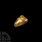 Animal Head Pendant 1st millennium B.C. A bifacial gold pendant in the form of a stylised goat head (or that of another horned quadruped); hollow-form...