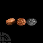North Syrian Seal with Winged Ibex 8th-7th century B.C. An oval red-brown limestone stamp seal engraved with a mythical creature, possibly a winged ib...