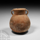 Vessel with Ledge Handles 4th-3rd millennium B.C. An early Bronze Age (phase 1) globular ceramic jar with broad neck and band of impressed rilling, tw...