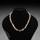 Western Asiatic Rock Crystal Necklace 1st millennium B.C. and later. A restrung group of rock crystal beads of various types; modern torpedo screw cla...