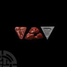 Western Asiatic Triangular Red Jasper Seal with Animal Handle 2nd-1st millennium B.C. A carved jasper stamp seal with triangular body, knop handle wit...