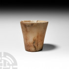 Western Asiatic Alabaster Cup 2nd-1st millennium B.C. An alabaster cup with waisted sidewall. 293 grams, 83 mm (3 1/4 in.). Acquired 1970s-1996. Prope...