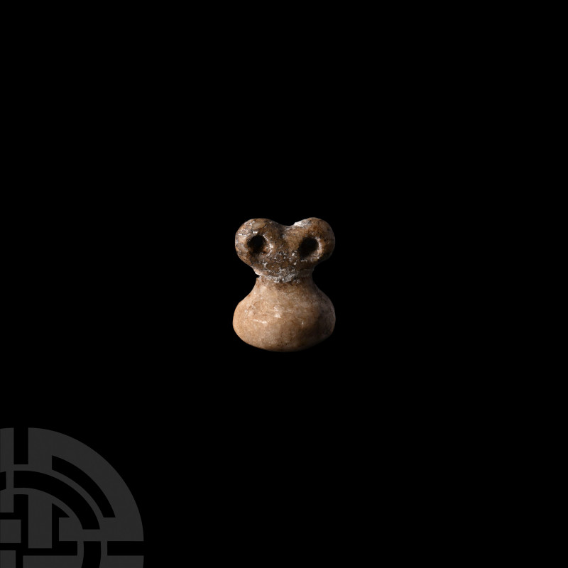 Miniature Tell Brak Marble Eye Idol Circa 3100-3000 B.C. A miniature marble 'eye...