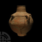 Western Asiatic Terracotta Teapot 1st millennium B.C. A ceramic vessel with carinated body, stepped shoulder, cylindrical neck and pedestal foot, thre...