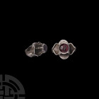 Sassanian Silver Architectural Seal Ring 3rd-6th century A.D. A polished amethyst cabochon bearing intaglio crowned profile bust, circular boss to bas...