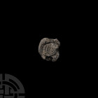 Western Asiatic Lead Menorah Sealing Circa 4th century A.D. or earlier. A sub-circular lead seal with impressed menorah to one face and indistinct des...