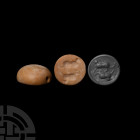 Jemdet Nasr Type Seal with Animal Uruk Period, 4th millennium B.C. A domed, discoid marble stamp seal bearing a drilled animal motif to the base in th...