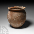 Bronze Age Holy Land Terracotta Storage Vessel 2nd millennium B.C. A piriform ceramic vessel with everted rim and flat base. 805 grams, 17 cm (6 3/4 i...