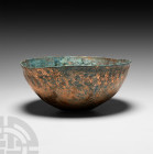 Western Asiatic Decorated Cup 1st millennium B.C. or later. A hemispherical copper-alloy cup decorated with a rosette to base, band of interlace aroun...