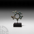 Amlash Chariot Fitting 13th-12th century B.C. A copper-alloy chariot fitting formed as a ring with conical knop and four stylised horses standing arou...