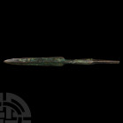 Luristan Spearhead with Symbols 13th-6th century B.C. A bronze spearhead composed of a leaf-shaped blade with midrib to both faces, facetted, octagona...