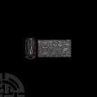 Old Babylonian Cylinder Seal with Worshipping Scene 2nd millennium B.C. A haematite cylinder seal with a worshipper being led by a deity wearing a hor...