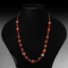 Western Asiatic Agate Bead String 20th century A.D. and earlier. A string of agate and other stone beads of various shapes and sizes; modern torpedo s...