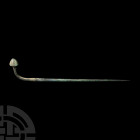 Large Luristan Poppy-Headed Pin 13th-7th century B.C. A bronze pin with tapering, round-section body, expanded pierced panel towards the neck, rectang...