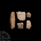 Mesopotamian Cuneiform Tablet Fragment Collection Circa 2nd millennium B.C. A group of five clay tablet fragments of various shapes and sizes, each wi...