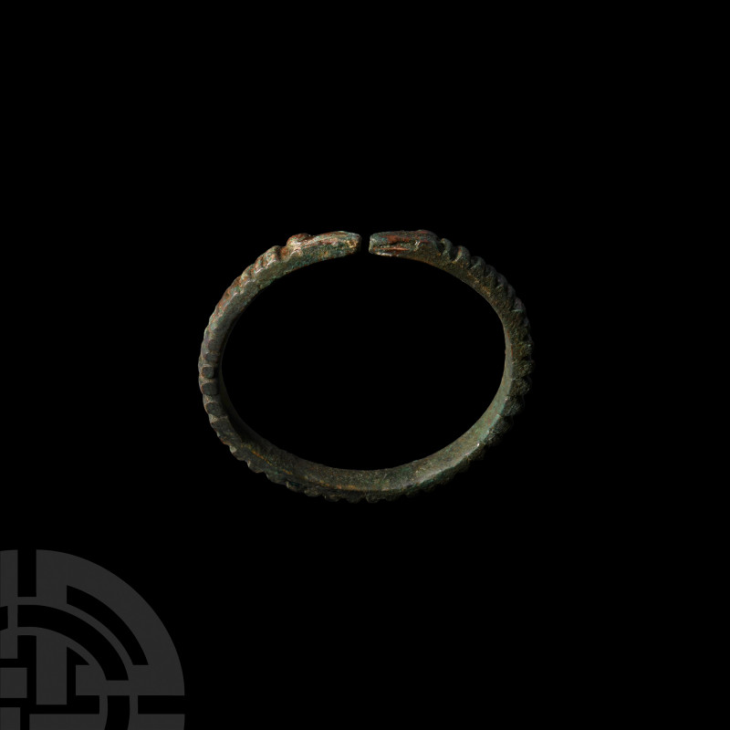 Western Asiatic Bracelet with Animal Head Terminals 1st millennium B.C. A penann...