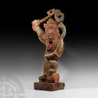 Large Chinese Painted Red Stone Guardian 19th century A.D. A large Ming style sandstone guardian figure modelled in an aggressive and dynamic posture ...
