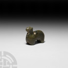 Chinese Han Jade Animal Amulet Han Dynasty, 206 B.C.-220 A.D. A highly stylised jade animal amulet in the form of a quadruped animal with pricked ears...