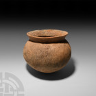 Siam Leather-Look Vessel Bang Chiang, 2nd millennium B.C. A ceramic vessel composed of a bulbous body with 'leather-look' design, everted rim and roun...