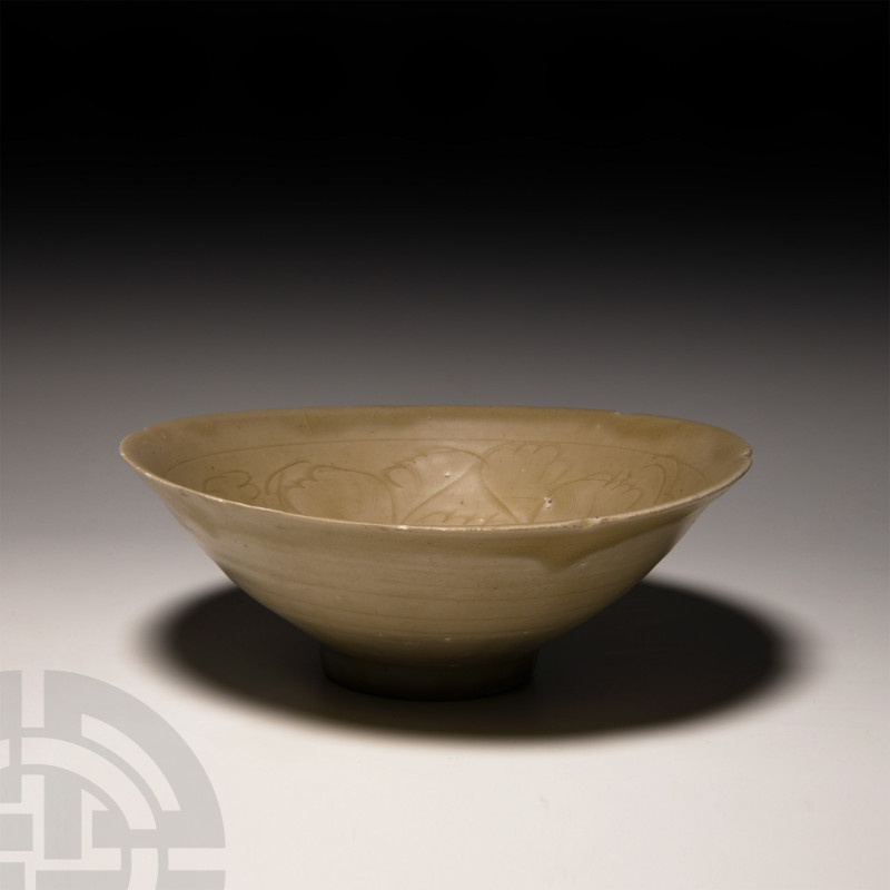 Chinese Decorated Celadon Bowl 10th-15th century A.D. A green-glazed ceramic cel...