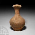 Chinese Han Lidded Ewer Han Dynasty, 206 B.C.-220 A.D. A terracotta ewer (hu) with bulbous body, narrow waisted neck expanding to a flared mouth, dome...