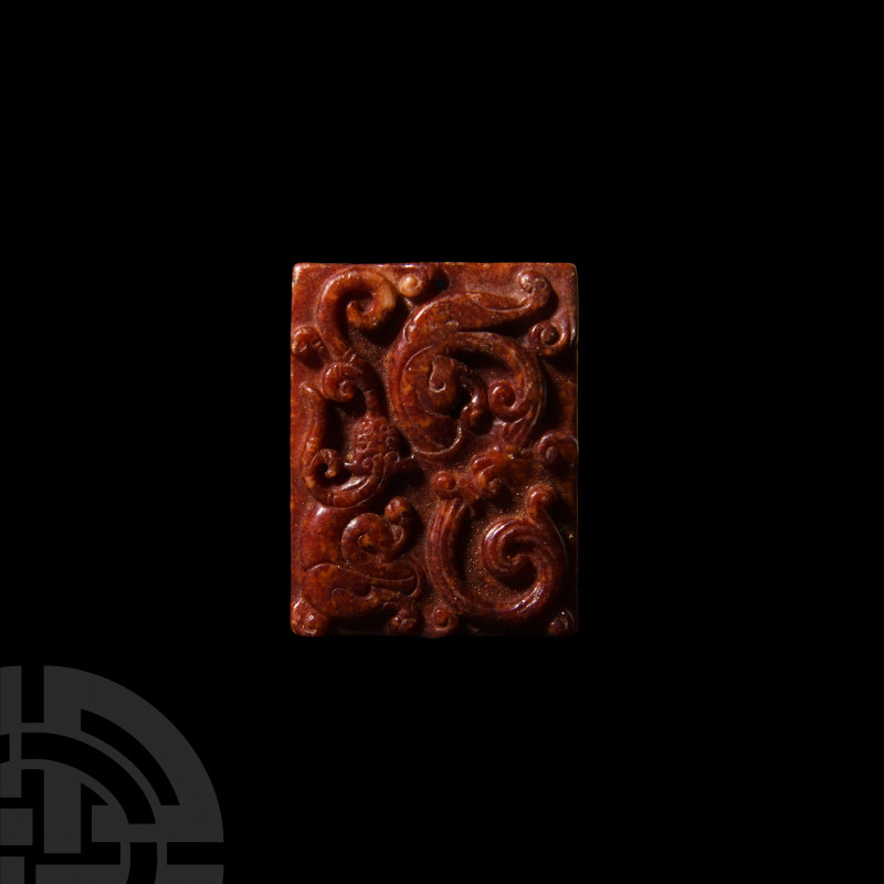 Chinese Amuletic Pendant 20th century A.D. A polished rectangular glass pendant ...