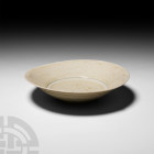 Chinese Glazed Bowl Circa 618-1279 A.D. A Tang or Song period ceramic bowl with conical body, decorated using a light blue glaze. 190 grams, 15.5 cm d...