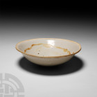 Chinese Glazed Bowl Circa 618-1279 A.D. A Tang or Song period ceramic bowl of conical form, decorated with a light blue glaze. 152 grams, 15 cm diamet...