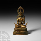 Sino-Tibetan Gilt Seated Buddha Figure 19th-early 20th century A.D. A gilt-bronze figure of Buddha sitting cross-legged on a lotus-flower dais, flamin...