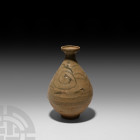 Chinese Glazed Vase 17th-18th century A.D. A piriform Yuan style provincial ceramic vase with stepped mouth, simple scrolling forms painted over the b...