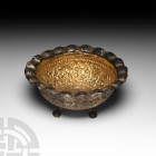 Chinese Style Gilt Silver Footed Bowl Circa 19th century A.D. A silver-gilt hemispherical bowl with piecrust style rim, body and rim decorated with re...