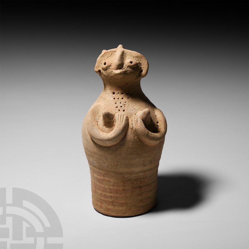 Indus Valley Fertility Figure Circa 3300-1300 B.C. A ceramic bell-shaped figure ...