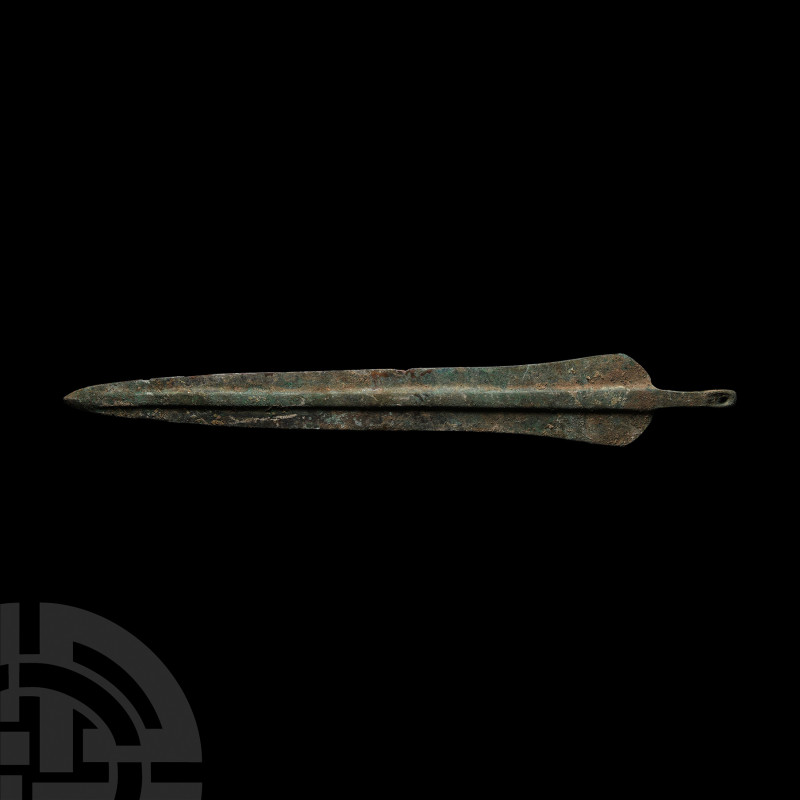 Luristan Dirk Blade 1000 B.C. A large tanged blade with broad midrib tapering to...