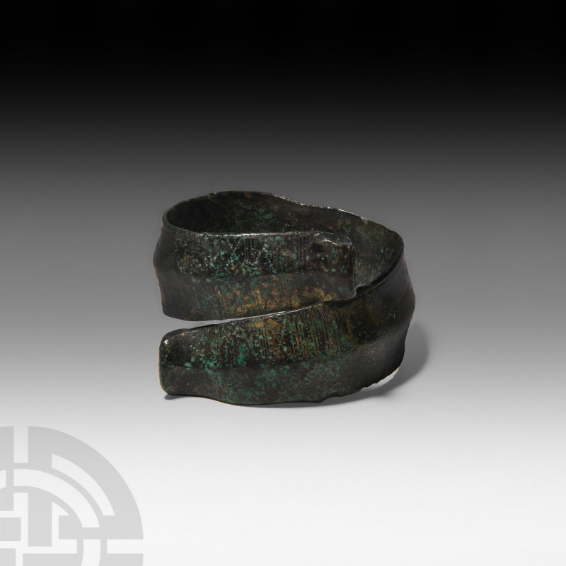 Large Danubian Celtic Coiled Armband Circa 1500 B.C. A large bronze spiral brace...