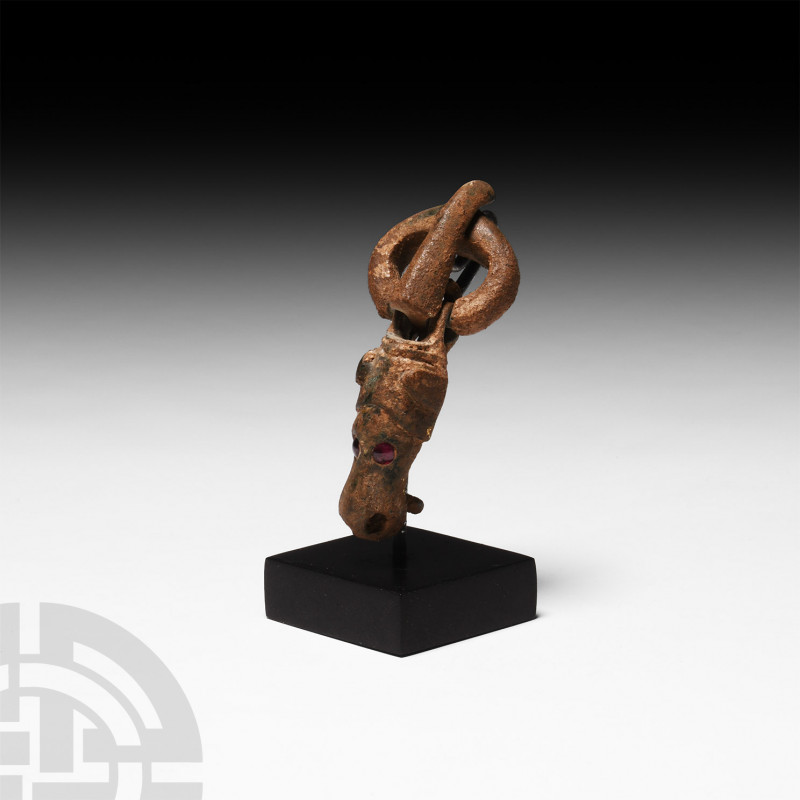 Migration Period Animal Buckle 4th-5th century A.D. A bronze buckle comprising a...