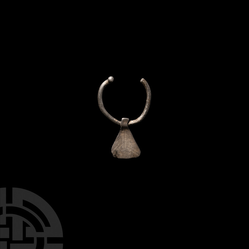 Viking Age Silver Axe Pendant 9th-12th century A.D. A silver pendant composed of...