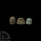 Medieval Thimble Group 15th-16th century A.D. A group of three thimbles, each with a dense series of dimples over the body. 20.9 grams total, 15-24 mm...