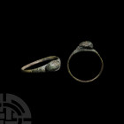 Medieval Ring with Bust 14th-15th century A.D. A finger ring composed of a slender hoop, expanding to an oval-shaped bezel bearing a mature male head ...