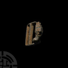 Medieval Buckle Loop with Crowned Bust Circa 14th century A.D. A bronze buckle or strap fitting with roughly D-shaped frame and off-centre bar, with s...