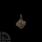 Medieval Heraldic Horse Harness Pendant with Bird of Prey Attacking a Rabbit Circa 14th century A.D. A horse harness pendant with a quatrefoil body an...