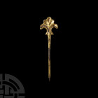 Medieval Gilt Pin with Fleur-De-Lys 14th-15th century A.D. A silver-gilt pin with a tapering, round-section body and stylised fleur-de-lys finial. 1.6...